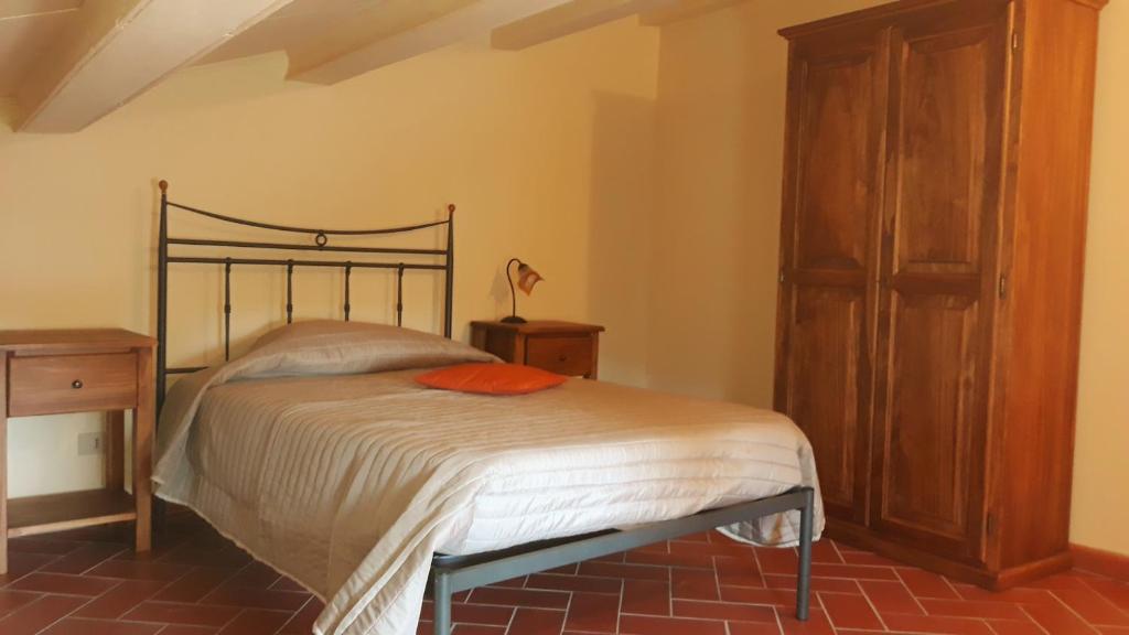 Posteľ alebo postele v izbe v ubytovaní La Casa del Gigli