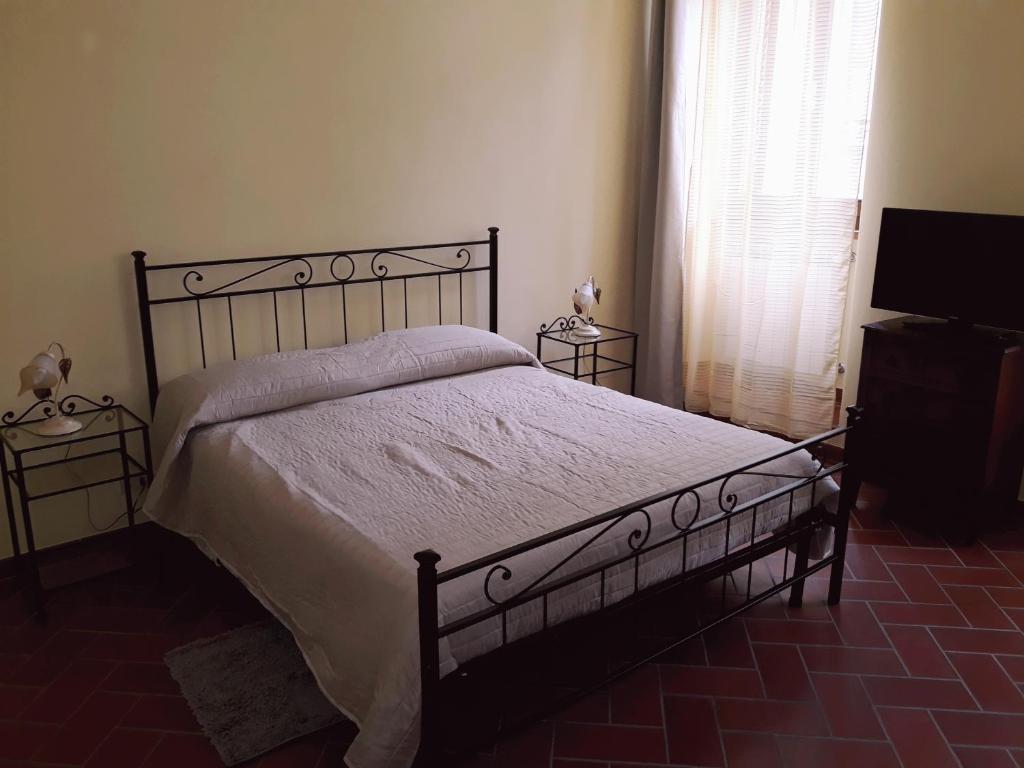 Posteľ alebo postele v izbe v ubytovaní La Casa del Gigli