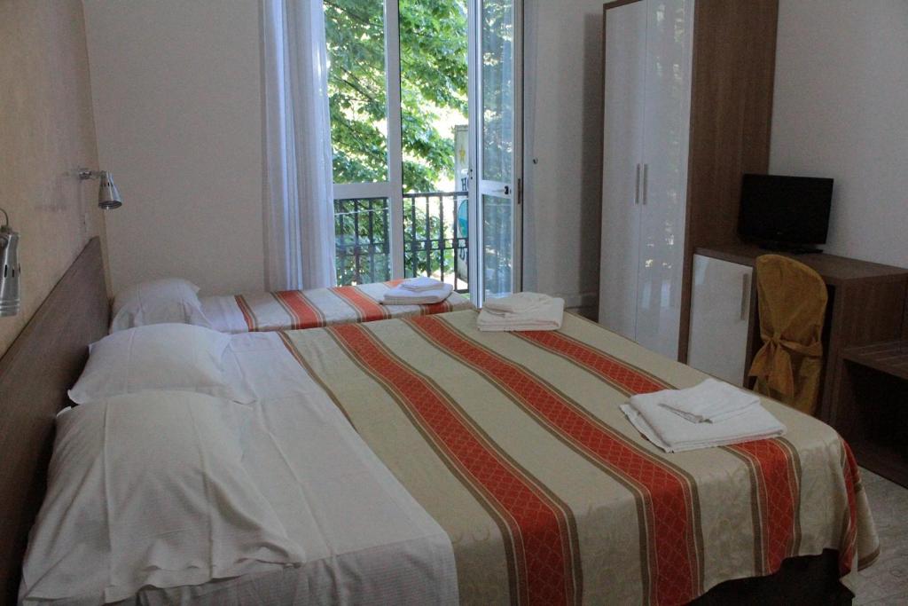 Postel nebo postele na pokoji v ubytování Hotel Derna