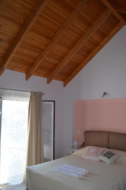 Postel nebo postele na pokoji v ubytování Romanza Studios