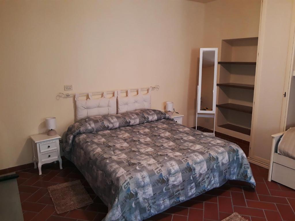 Posteľ alebo postele v izbe v ubytovaní La Casa del Gigli