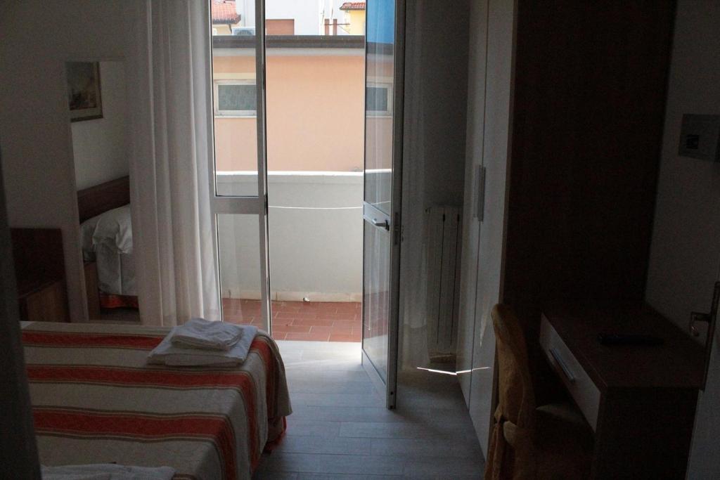Postel nebo postele na pokoji v ubytování Hotel Derna