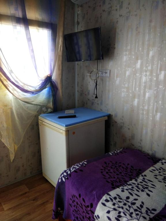Postel nebo postele na pokoji v ubytování Mini Hotel Уютный дворик
