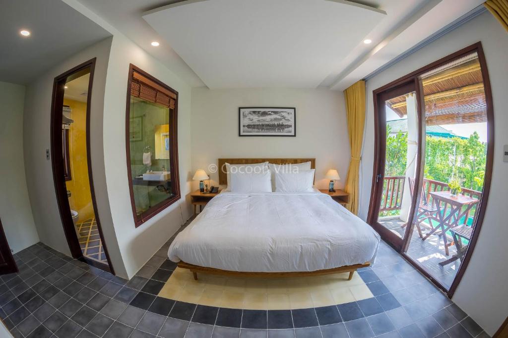 Postel nebo postele na pokoji v ubytování Cocoon Villa