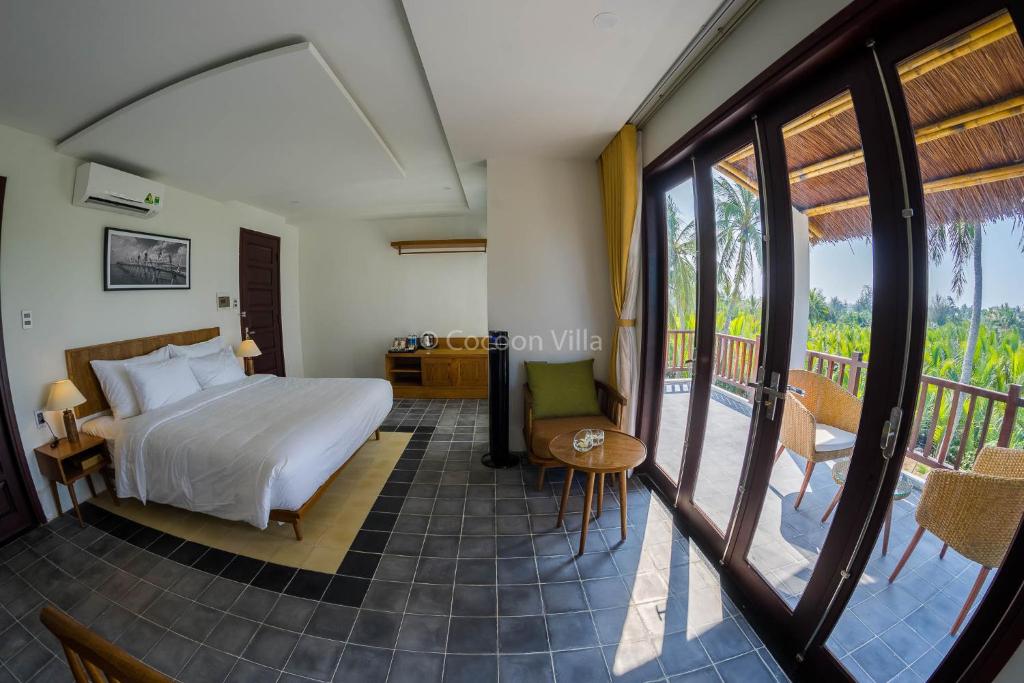 Postel nebo postele na pokoji v ubytování Cocoon Villa