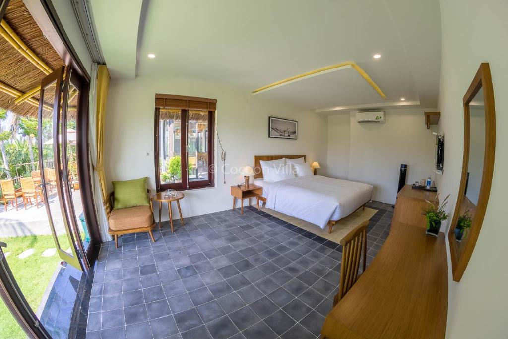 Postel nebo postele na pokoji v ubytování Cocoon Villa
