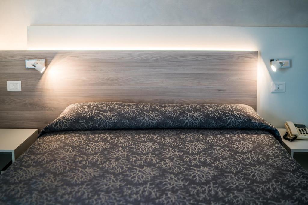 Postel nebo postele na pokoji v ubytování Hotel Ambassador Meuble