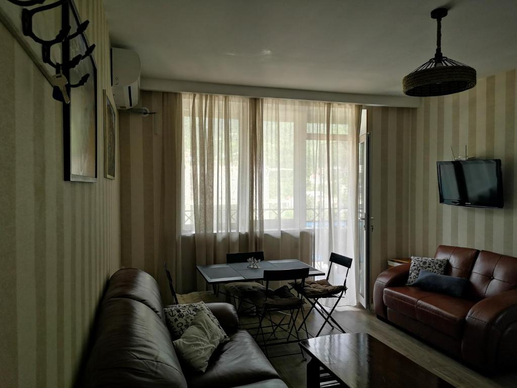 a living room with a couch and a table at Vacation home in Gonio in Gonio