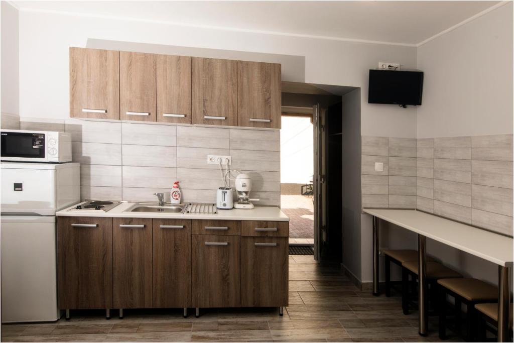 Kuchyň nebo kuchyňský kout v ubytování Toszkána Apartmanház