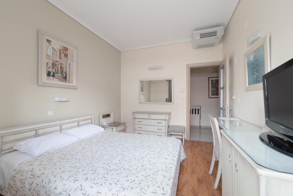 Postel nebo postele na pokoji v ubytování Lido Hotel
