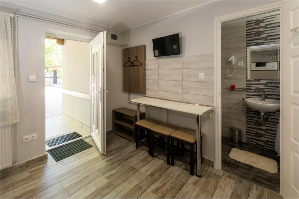 TV a/nebo společenská místnost v ubytování Toszkána Apartmanház