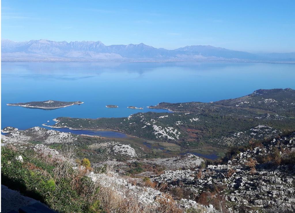 a view of a large body of water with mountains at Livari Viewpoint in Livari