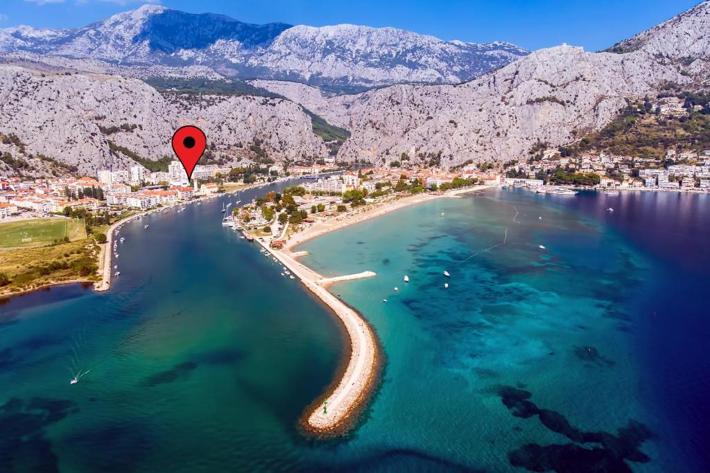 a hot air balloon flying over a beach at Apartmani Ribnjak Seka in Omiš