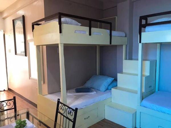 Postel nebo postele na pokoji v ubytování Palompon lodge