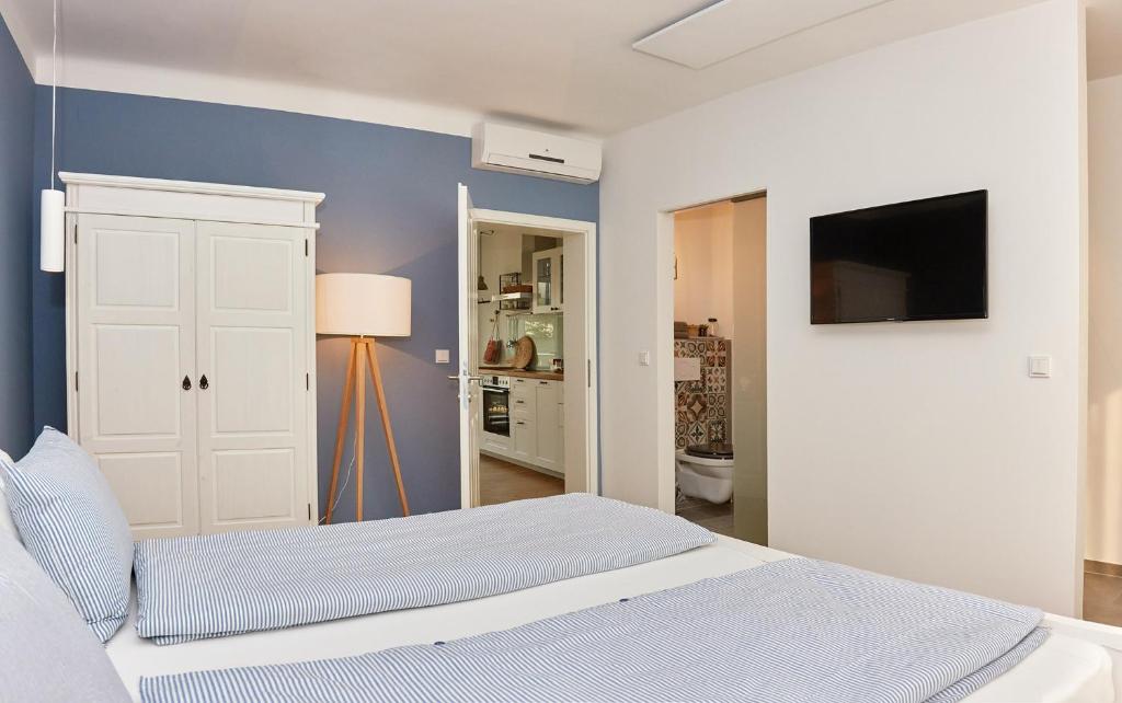 Postel nebo postele na pokoji v ubytování Logis 11 Apartments