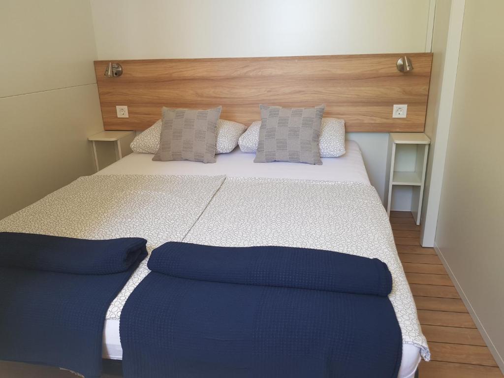Postel nebo postele na pokoji v ubytování Kamp Lunga