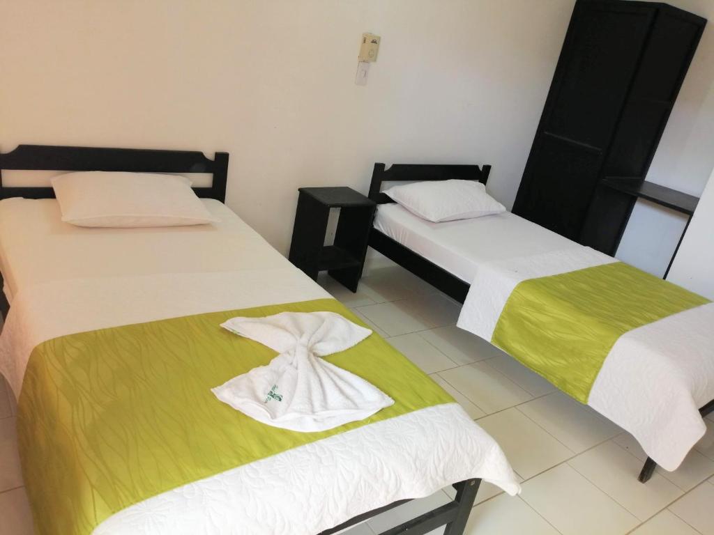 Postel nebo postele na pokoji v ubytování Hotel Tame Real