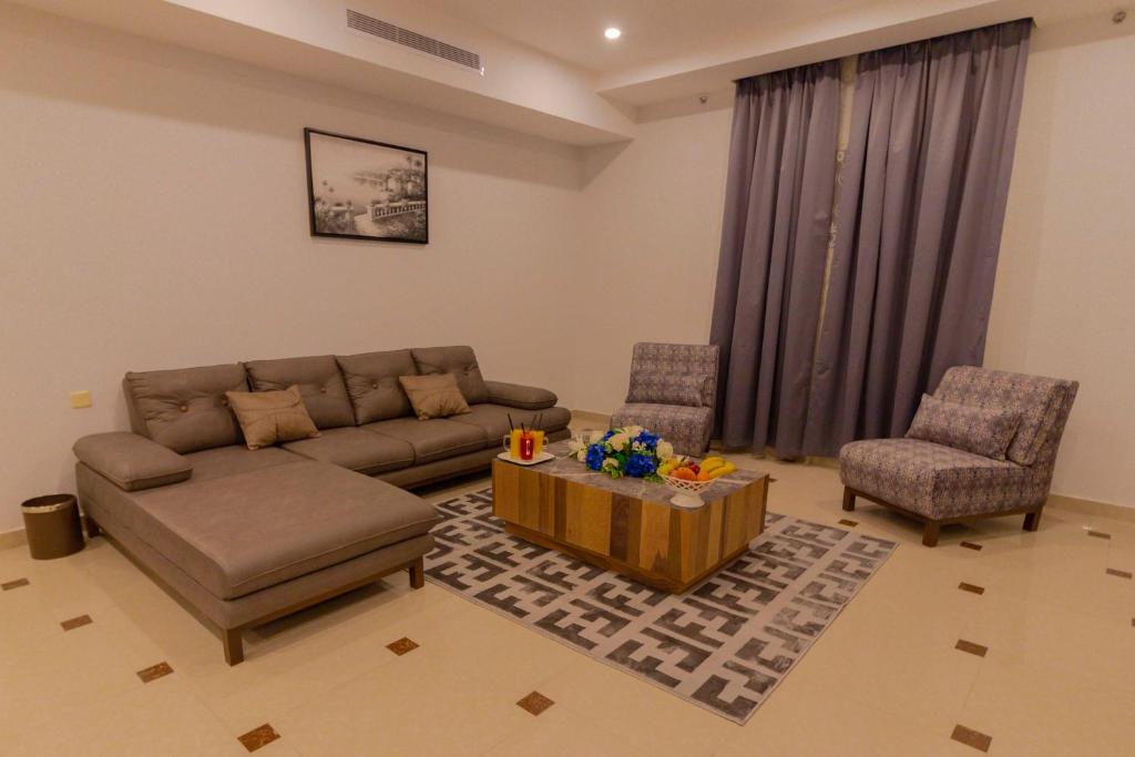 Posezení v ubytování Nukhbat Al Makan Apartment Hotel