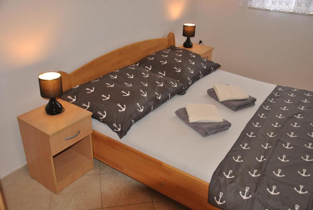 Posteľ alebo postele v izbe v ubytovaní Apartments Villa Macola