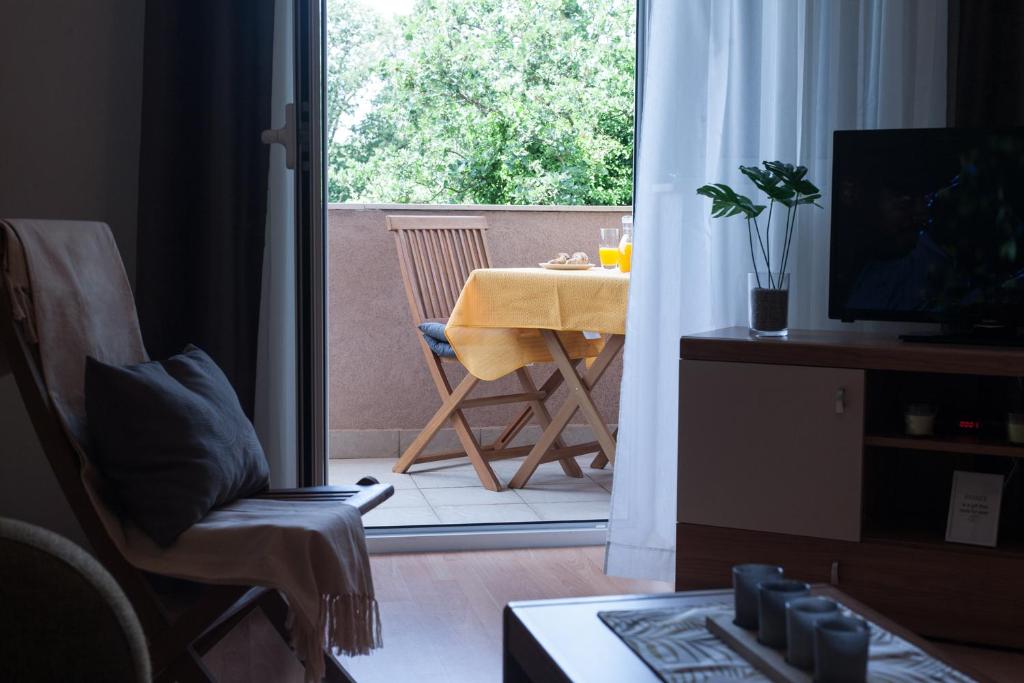 TV a/nebo společenská místnost v ubytování Apartment Helga