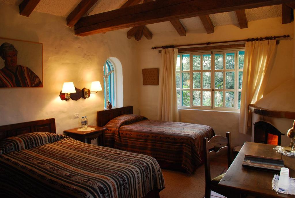 Tempat tidur dalam kamar di Las Palmeras Inn