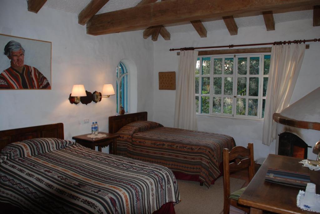 Postel nebo postele na pokoji v ubytování Las Palmeras Inn