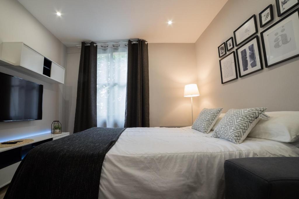 Posteľ alebo postele v izbe v ubytovaní Apartamento Logroño Catedral