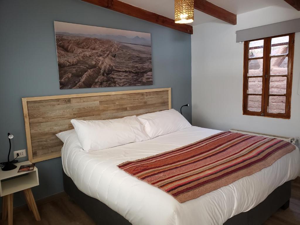 Postel nebo postele na pokoji v ubytování Hotel Jardin Atacama