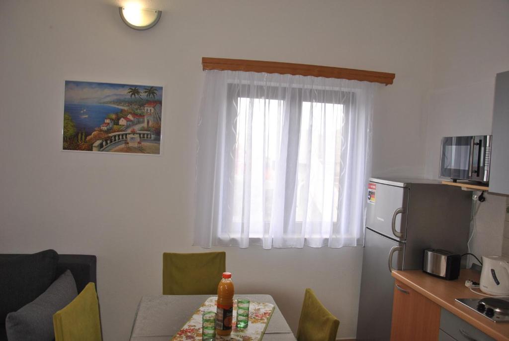 Kuchyňa alebo kuchynka v ubytovaní Apartments Villa Macola
