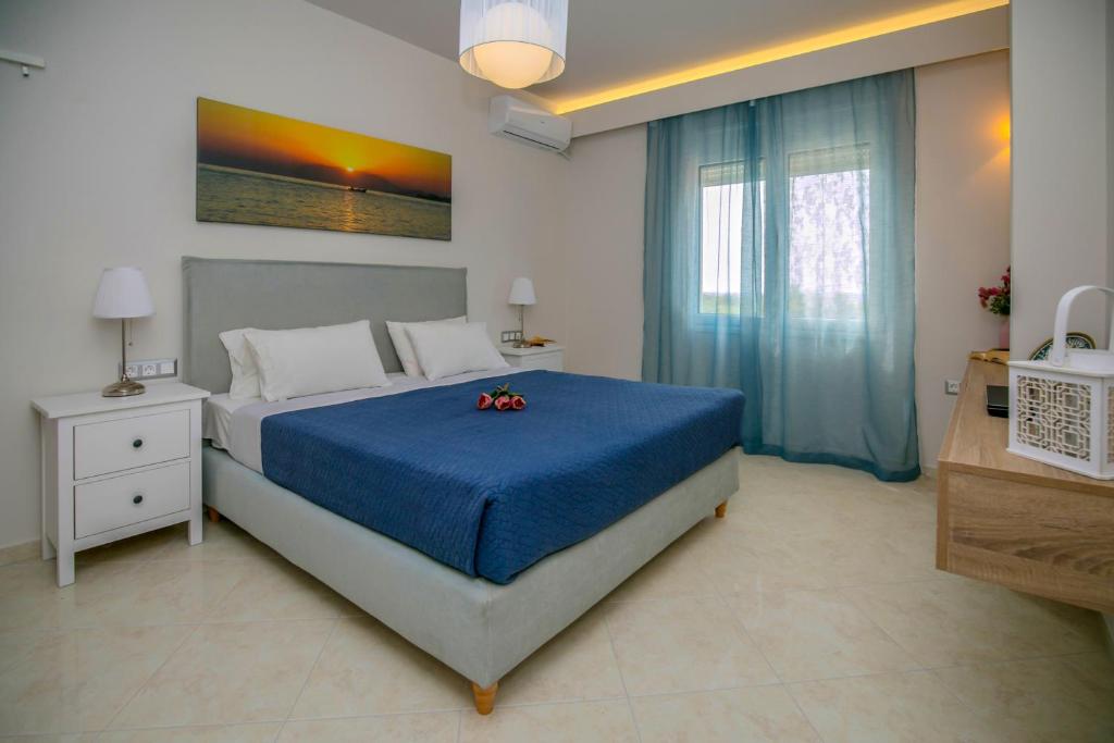 Posteľ alebo postele v izbe v ubytovaní Evgenia Apartment
