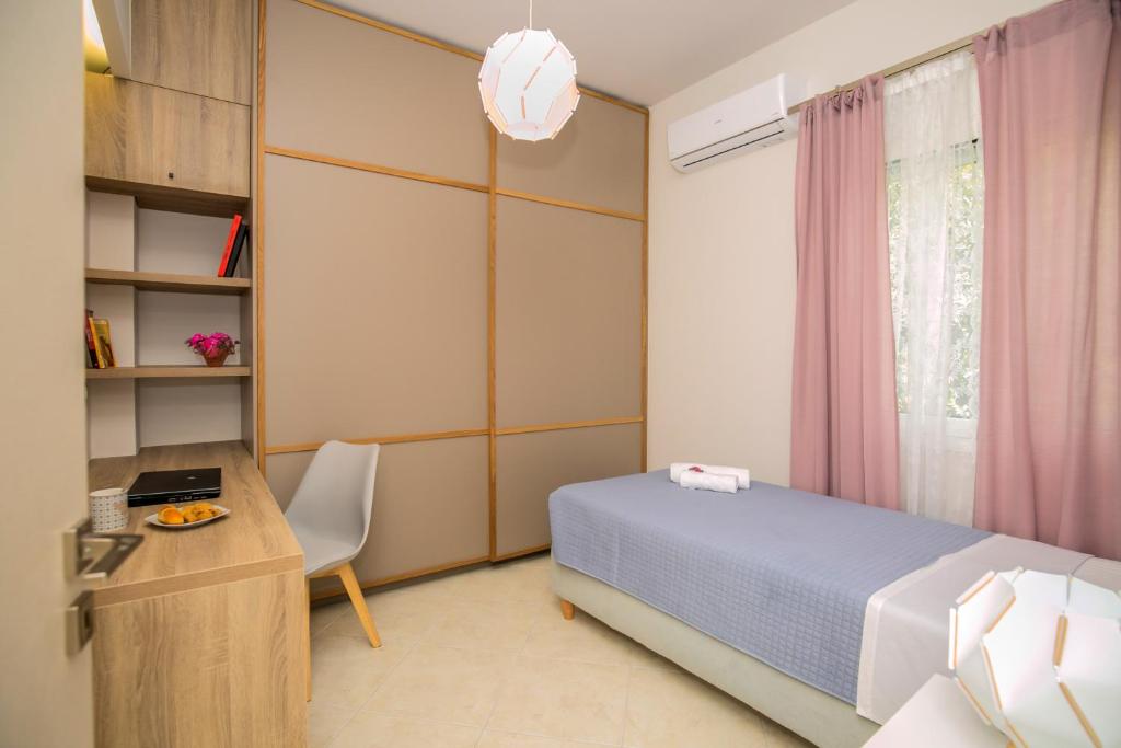 Posteľ alebo postele v izbe v ubytovaní Evgenia Apartment