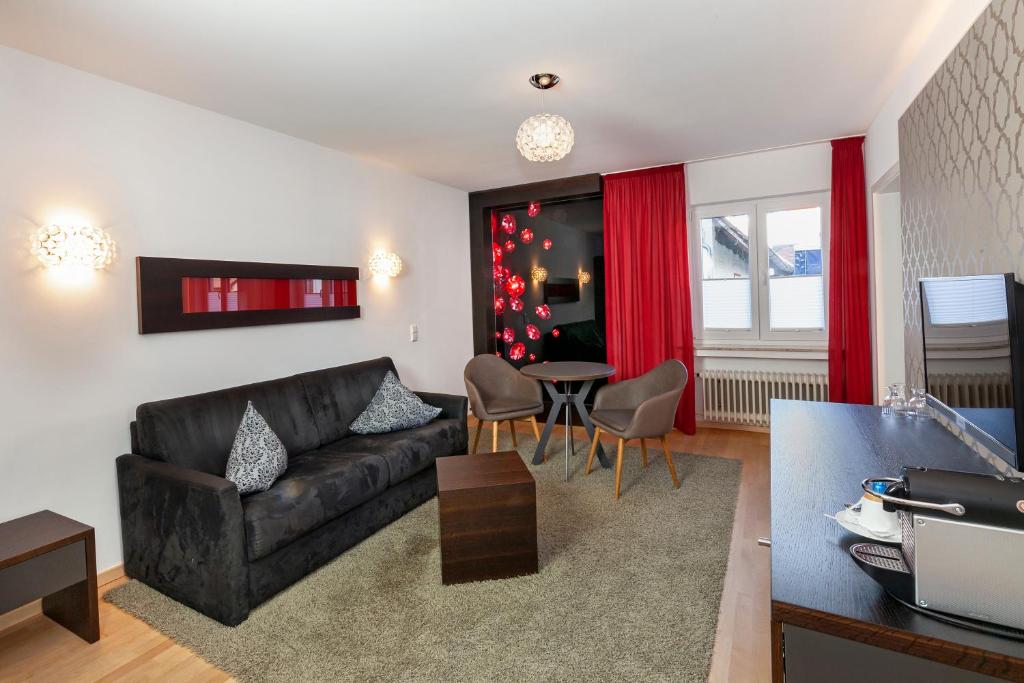 TV a/nebo společenská místnost v ubytování Hotel Hagnauer Seeperle