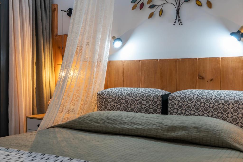 Postel nebo postele na pokoji v ubytování Aurum