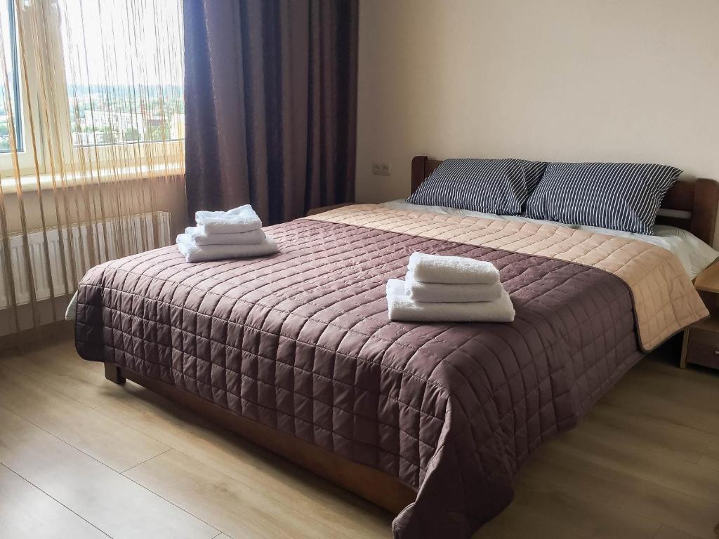 Кровать или кровати в номере Arkadia Apartment/в 43 Жемчужине у моря