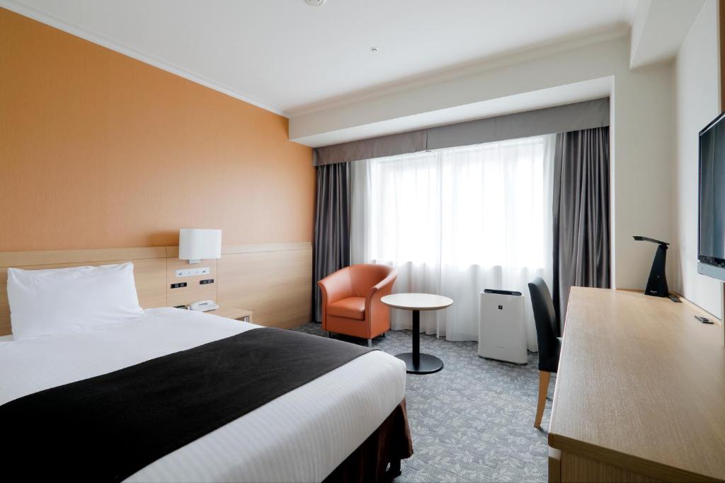 Postel nebo postele na pokoji v ubytování Sapporo Excel Hotel Tokyu