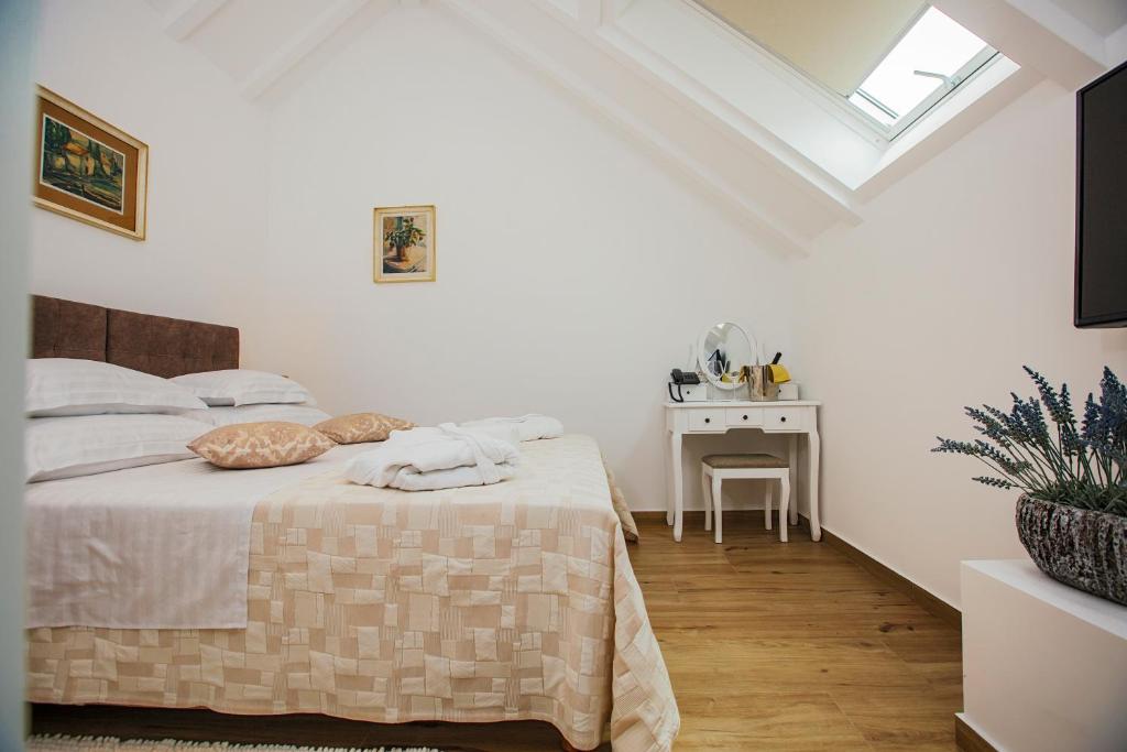 Postel nebo postele na pokoji v ubytování Heritage Hotel Dea Hvar