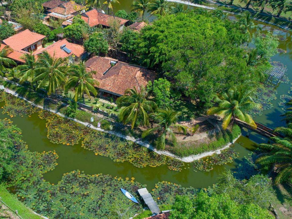 an aerial view of a house in the middle of a river at Ho Tram Beach Boutique Resort & Spa in Ho Tram