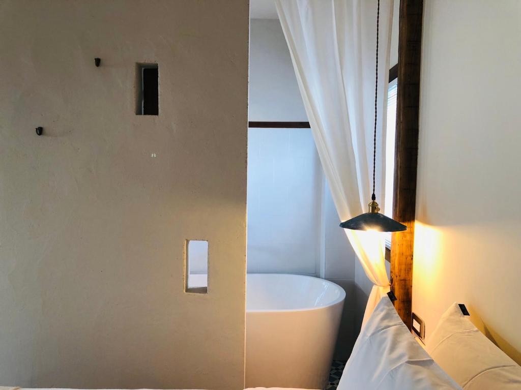 Postel nebo postele na pokoji v ubytování Casa Ostia
