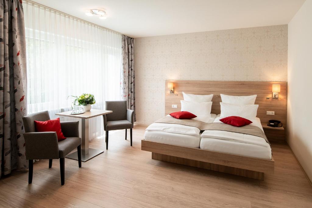 Postel nebo postele na pokoji v ubytování Gästehaus Sanssouci