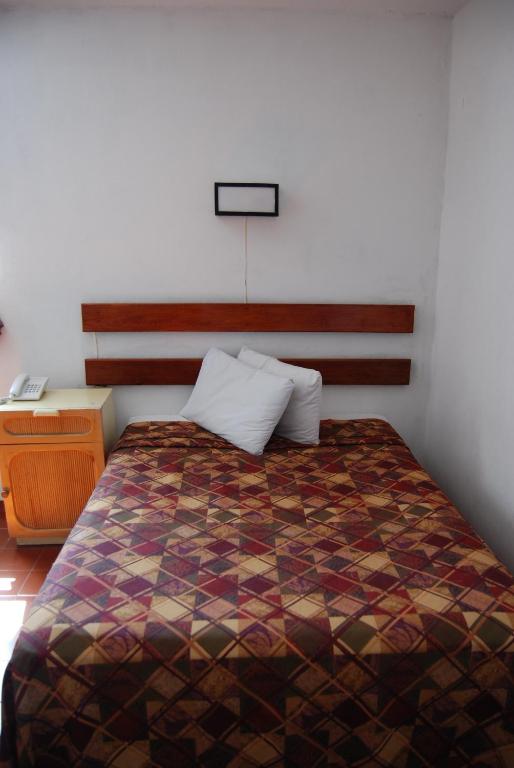 Postel nebo postele na pokoji v ubytování Hotel Alux Cancun