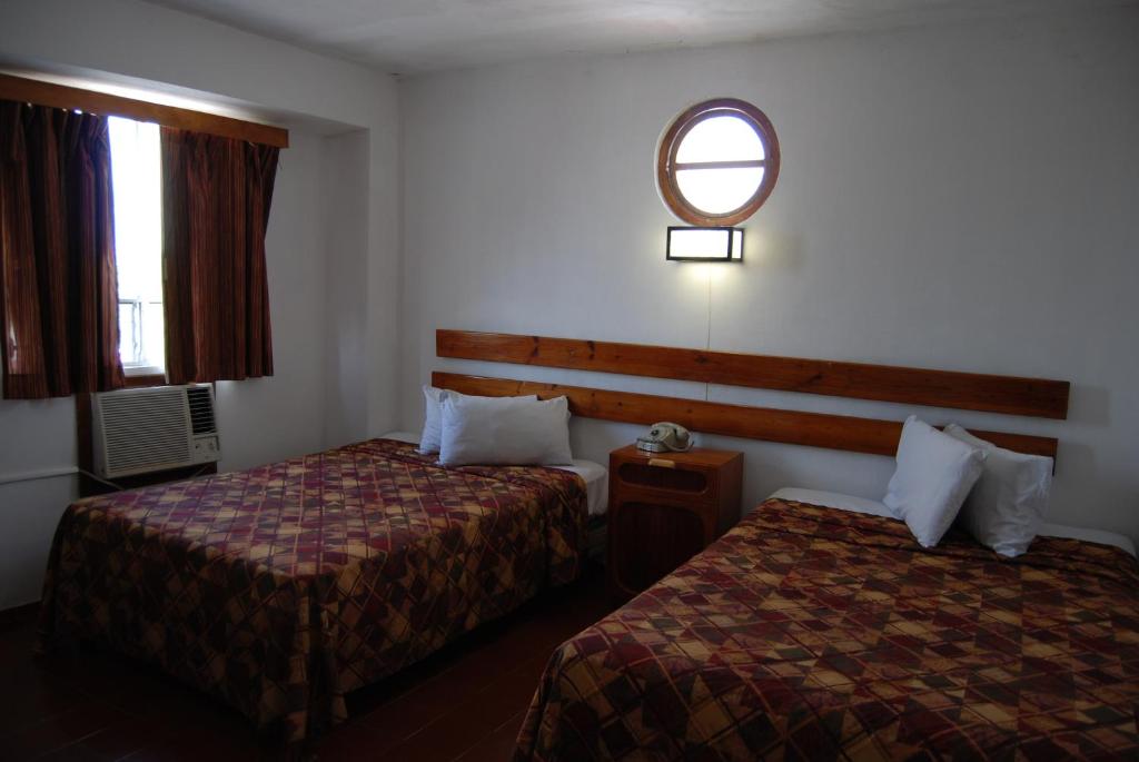 Postel nebo postele na pokoji v ubytování Hotel Alux Cancun
