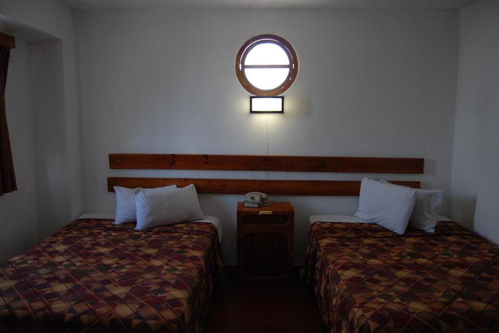 Postel nebo postele na pokoji v ubytování Hotel Alux Cancun