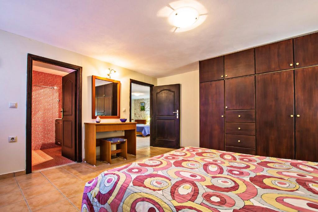 A bed or beds in a room at The Vivian - Luxury Stone Villa