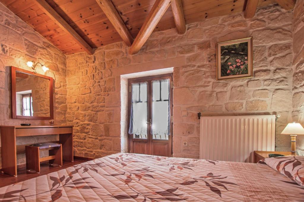A bed or beds in a room at The Vivian - Luxury Stone Villa