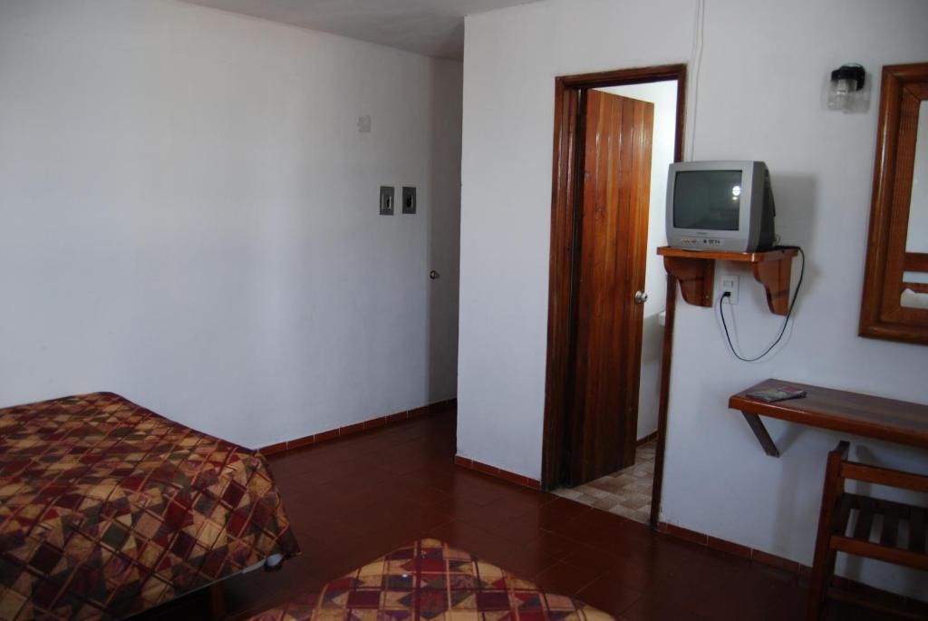 TV a/nebo společenská místnost v ubytování Hotel Alux Cancun