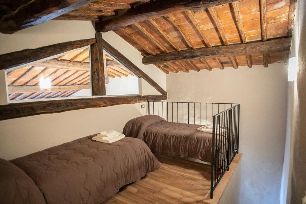 Łóżko lub łóżka w pokoju w obiekcie Borgo Casa al Vento
