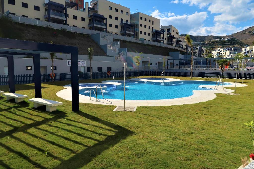 Bazén v ubytovaní RESIDENCIAL PLAYA CABRIA alebo v jeho blízkosti