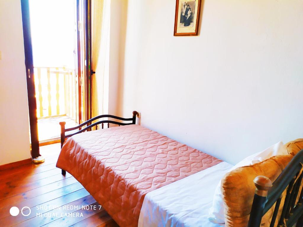 Postel nebo postele na pokoji v ubytování Villa Chrysodimi