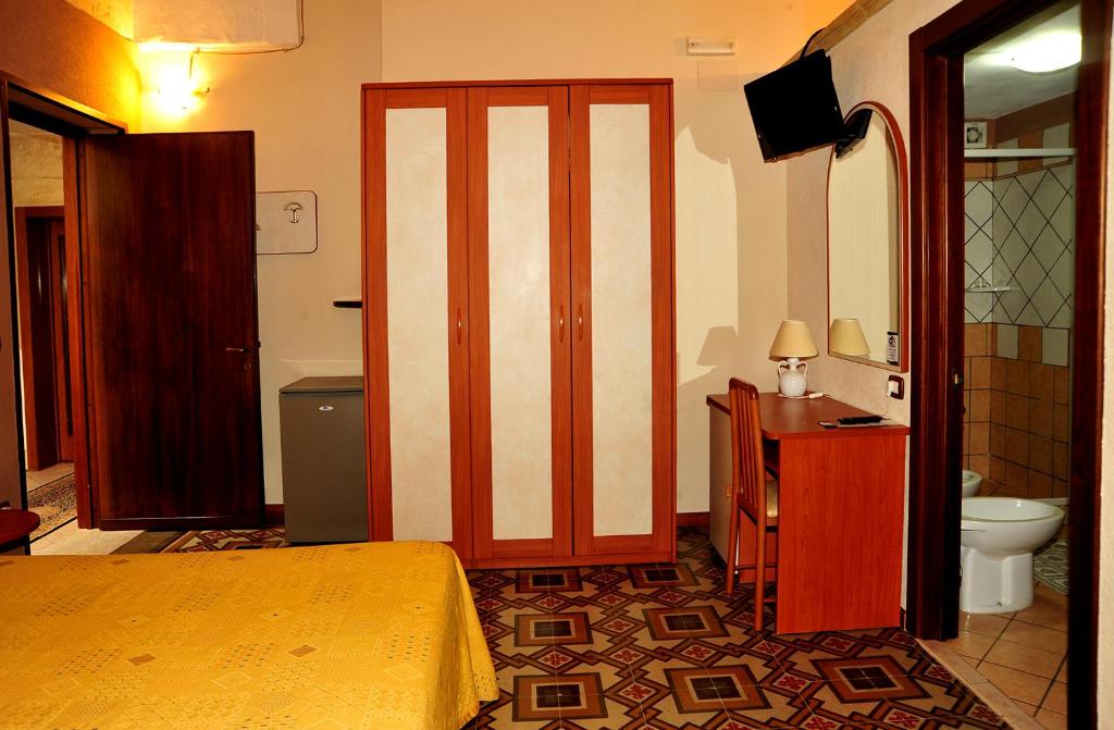 Łóżko lub łóżka w pokoju w obiekcie B&B Viaprimaldo Camere