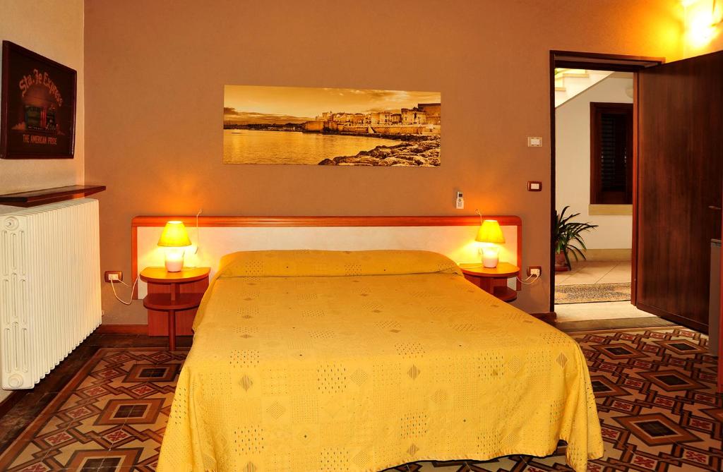 Łóżko lub łóżka w pokoju w obiekcie B&B Viaprimaldo Camere